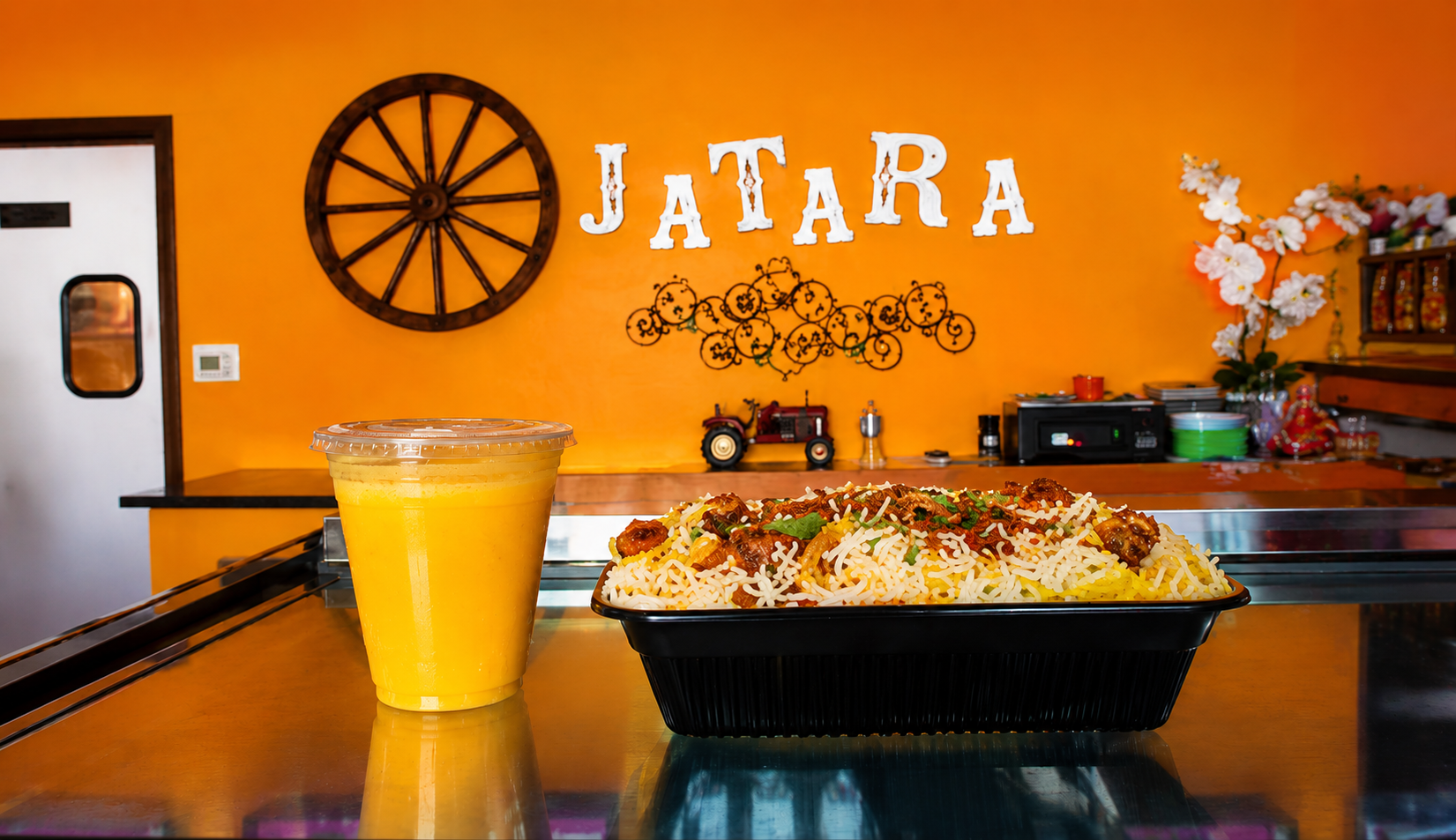 Biryani with mango lassi at Jatara Indian Kitchen in Prosper, TX